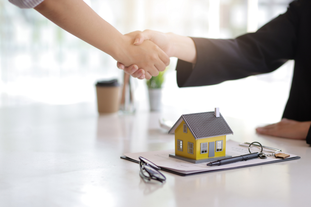 Real Estate Agent Shakes Hands